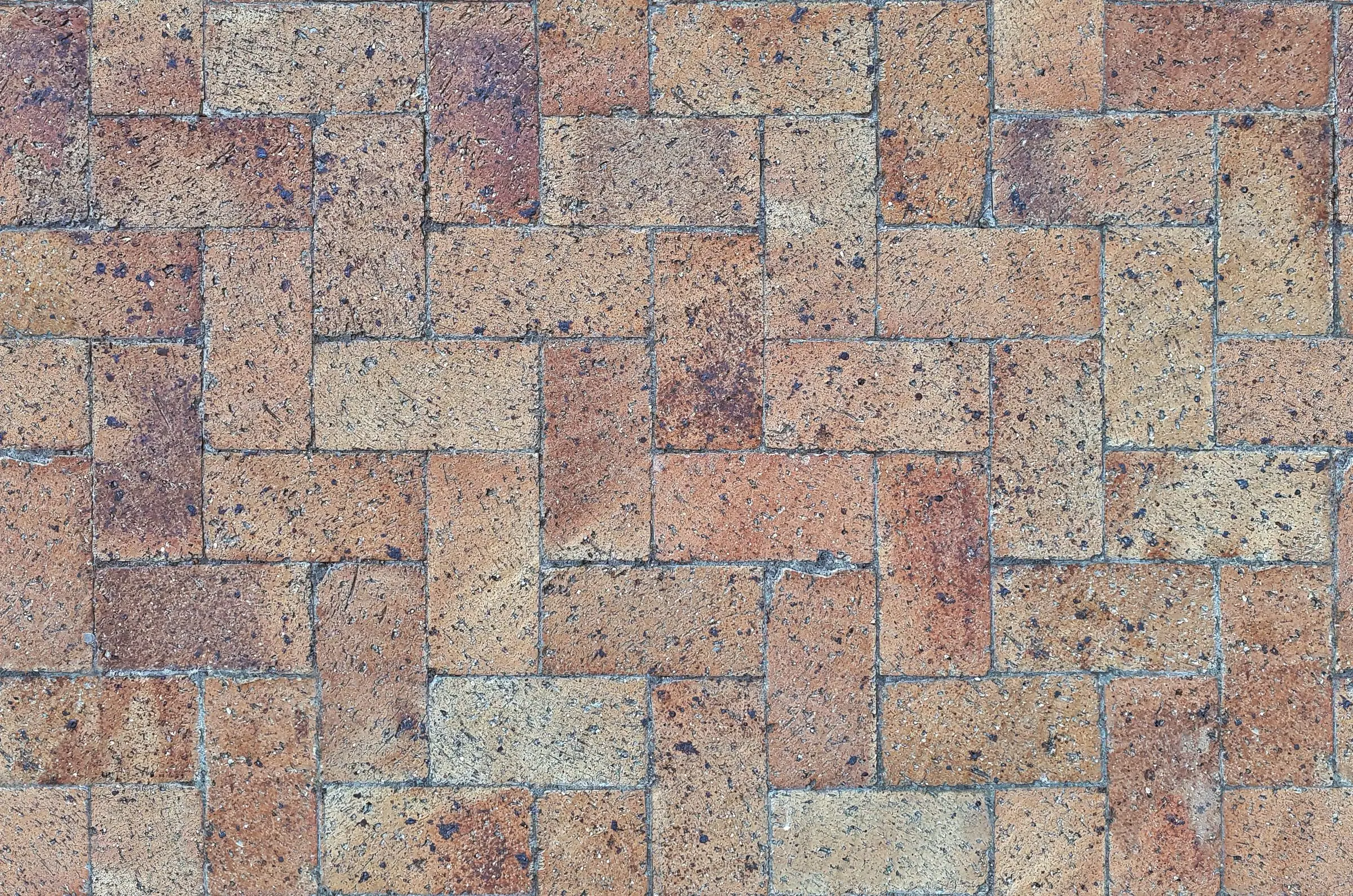 Close view of brick pavers in a basketweave pattern